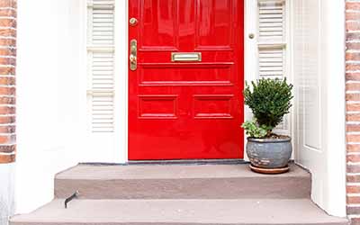 red front door with mail slot